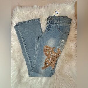 Stylish Blue Jeans with Tan Embellishments